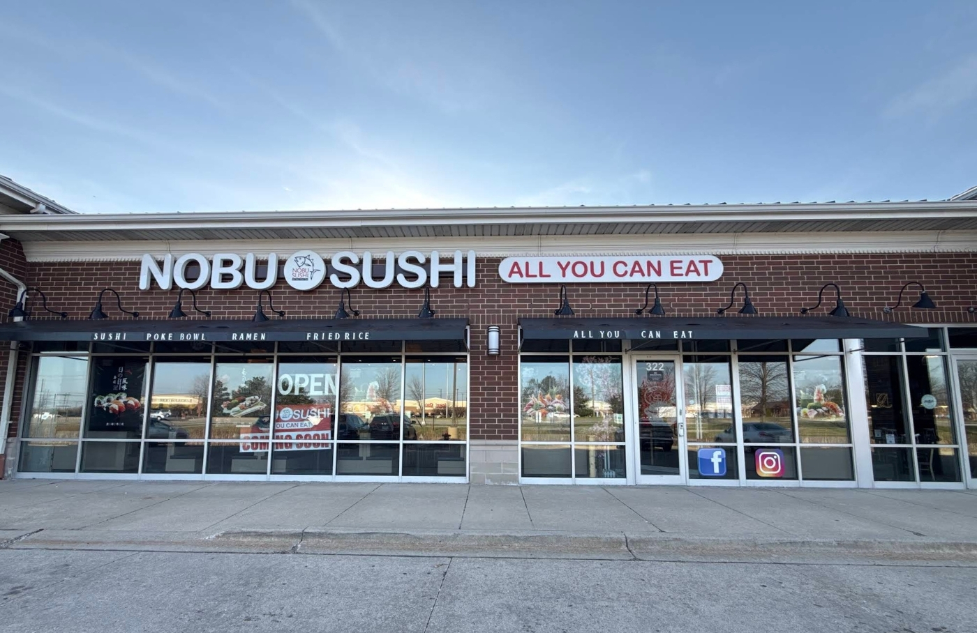 The Nobu Sushi storefront on Randall Road in South Elgin, Illinois at dusk.